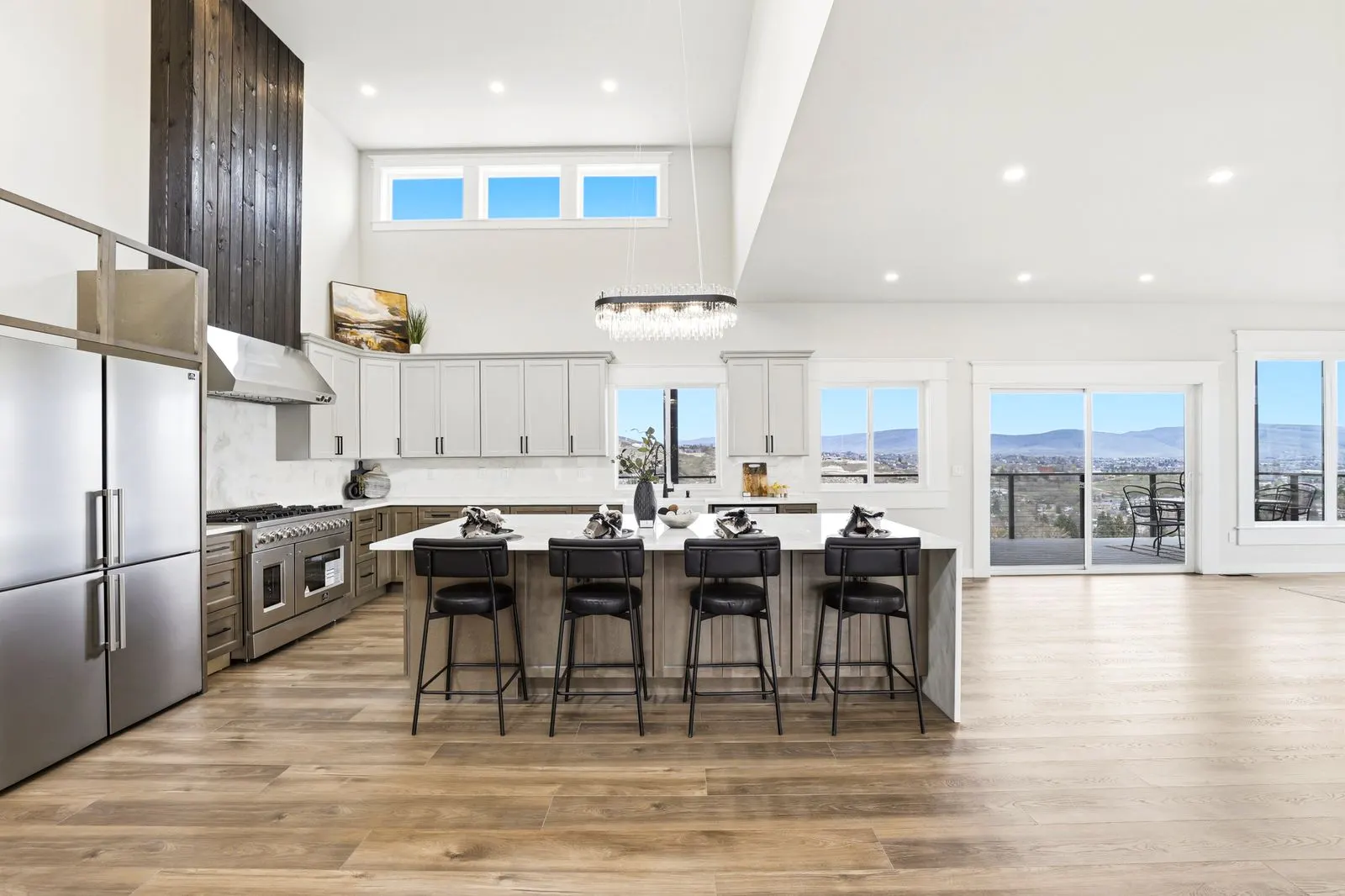Forno gas range with smoked-wood hood rising to the vault