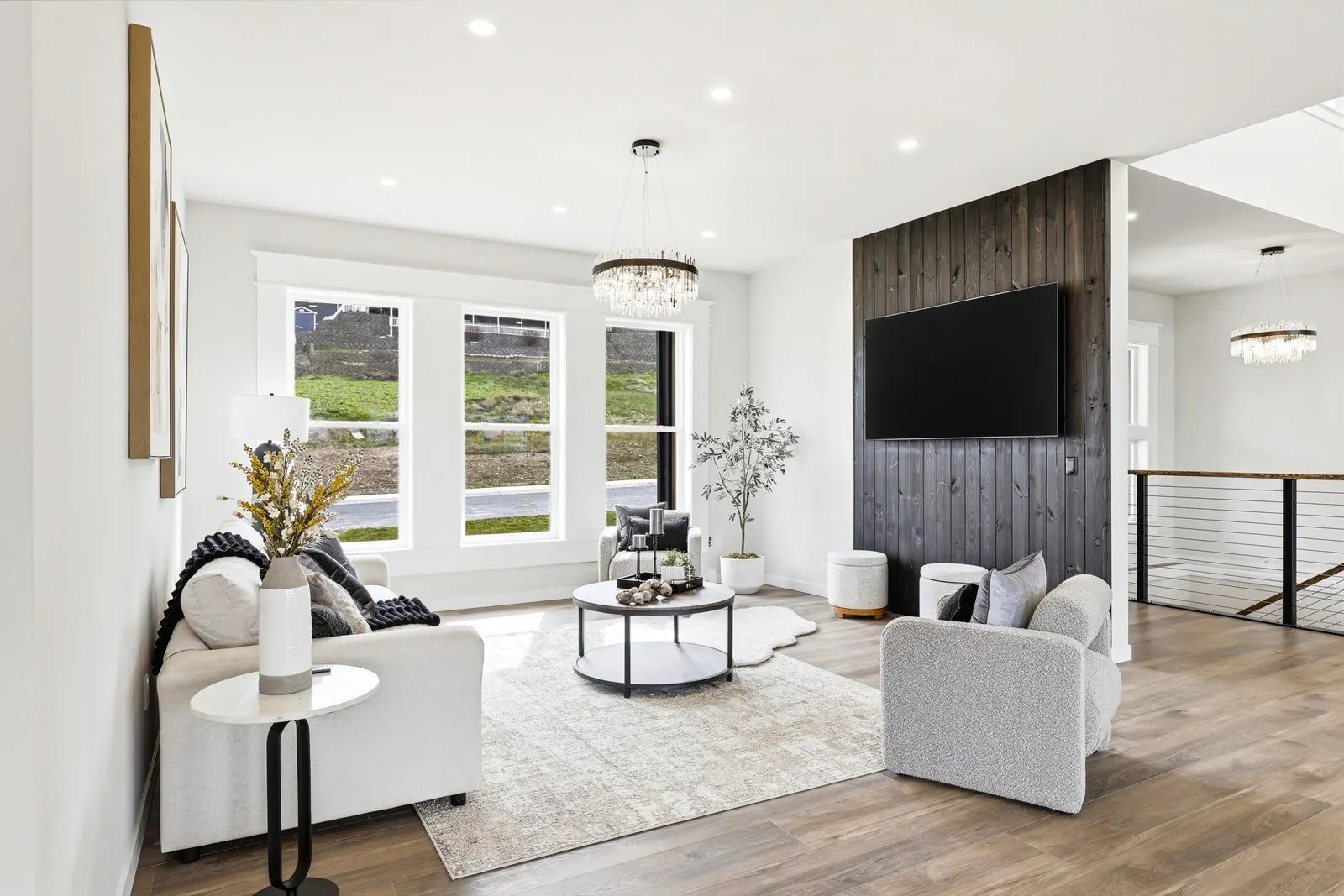 Great room with statement fireplace and valley views