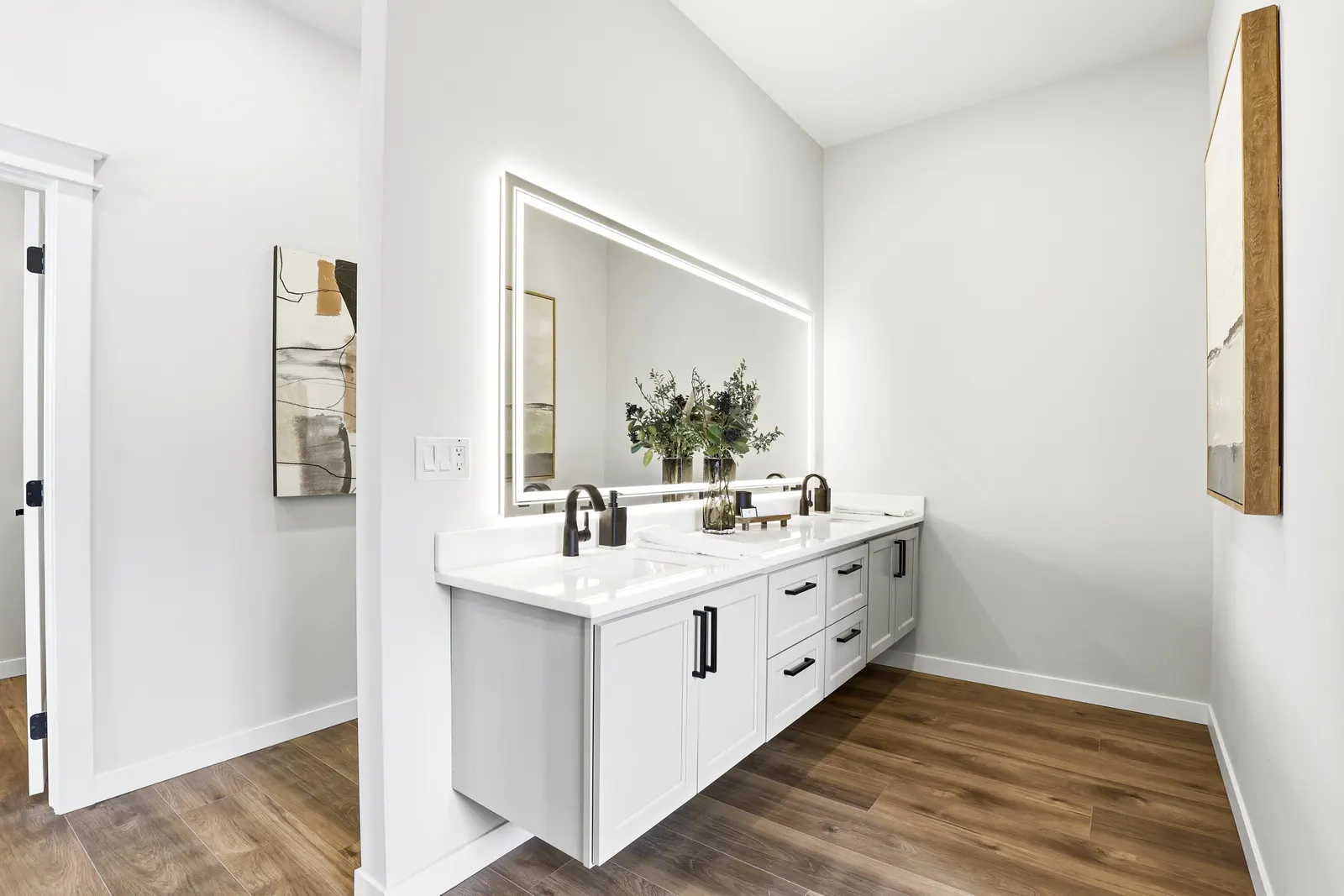 Primary bath dual vanities with backlit mirror